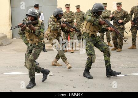 Fuzileiros Navais da Marinha de Guerra Angolana Angolan Marines practice clearing a room during a training exercise March 4, 2015 in Luanda, Angola. Stock Photo