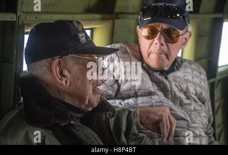 Reporter Tom Brokaw (right) interviews World War II veteran Leslie Cruse during a flight inside a C-47 Skytrain aircraft that flew during D-Day June 5, 2014 in Normandy, France. Stock Photo
