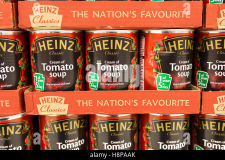 tins of Heinz tomato soup on supermarket shelves Stock Photo