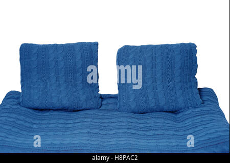 sofa and two pillows in blue isolated on white background Stock Photo