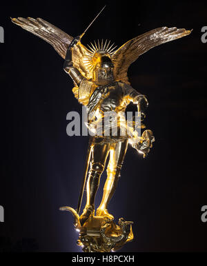 Statue of Archangel Saint Michael slaying a dragon next to promenade of ...