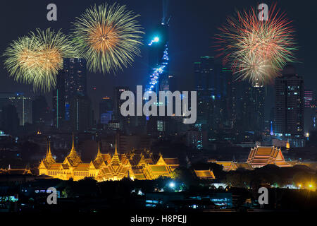 Beautiful fireworks celebrating new year with grand palace and Bangkok city in background at Bangkok, Thailand Stock Photo