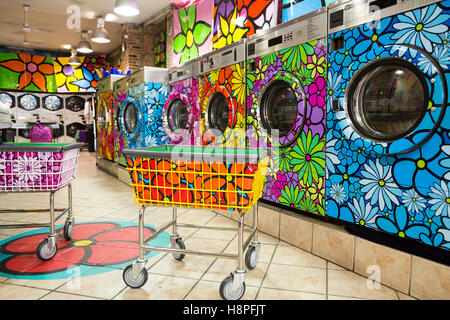 Unique retro painted washer / dryers in a local laundromat, New York City, NY, USA Stock Photo