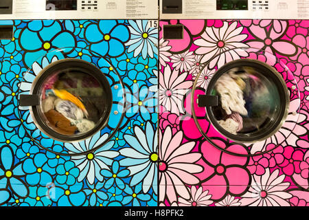 Unique retro painted washer / dryers in a local laundromat, New York City, NY, USA Stock Photo