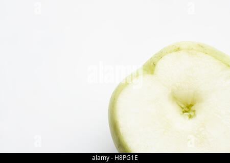 Fresh green apple cut in half Stock Photo