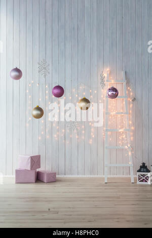 Christmas decoration on white background. Pink gift boxes with golden and  balls Stock Photo
