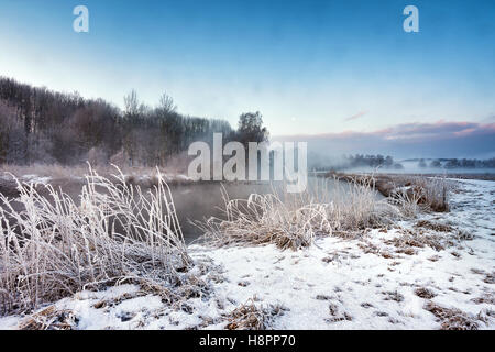 Winter misty morning on the river. Rural foggy and frosty scene in Belarus Stock Photo