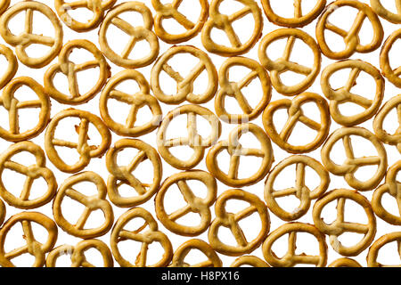 Salty pretzels, isolated on white background Stock Photo - Alamy