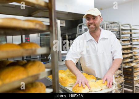Interior of a Morrisons supermarket . a man works in the bakery Stock Photo