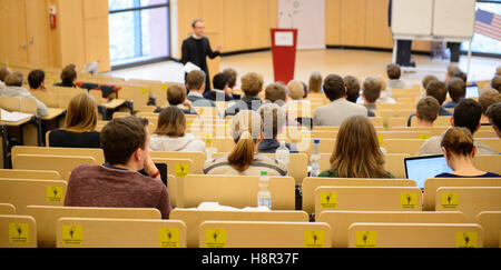 Students listen to a lecture in the Helmut Schmidt-Auditorium, at the Bucerius Law School in Hamburg, Germany, 9 November 2016. Photo: Daniel Reinhardt/dpa Stock Photo