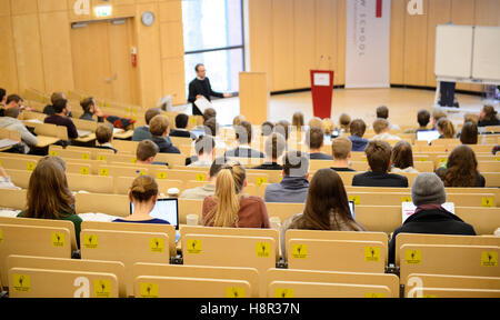 Students listen to a lecture in the Helmut Schmidt-Auditorium, at the Bucerius Law School in Hamburg, Germany, 9 November 2016. Photo: Daniel Reinhardt/dpa Stock Photo