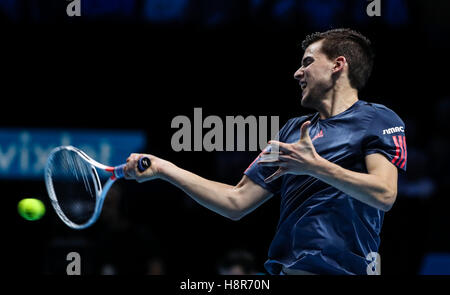 London, UK. 15th Nov, 2016. Austria's Dominic Thiem returns against France's Gael Monfils during their round robin stage men's singles match on day three of the ATP World Tour Finals tennis tournament in London on Nov. 15, 2016. Thiem won the match 2-1. Credit:  Tang Shi/Xinhua/Alamy Live News Stock Photo