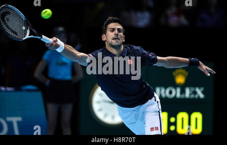 London, UK. 15th Nov, 2016. Serbia's Novak Djokovic returns to Canada's Milos Raonic during their round robin stage men's singles match at the ATP World Tour Finals tennis tournament in London on November 15, 2016. Djokovic won the match 2-0. Credit:  Tang Shi/Xinhua/Alamy Live News Stock Photo