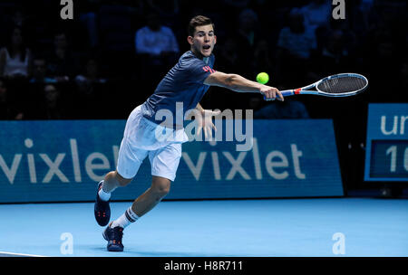 London, UK. 15th Nov, 2016. Austria's Dominic Thiem returns against France's Gael Monfils during their round robin stage men's singles match on day three of the ATP World Tour Finals tennis tournament in London on Nov. 15, 2016. Thiem won the match 2-1. Credit:  Tang Shi/Xinhua/Alamy Live News Stock Photo