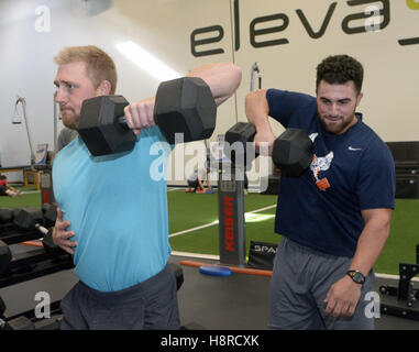 Houston Astros' Alex Bregman, left, points to a camera after hitting a home  run as catcher Christian Vazquez looks to the camera too during the eighth  inning of a baseball game against