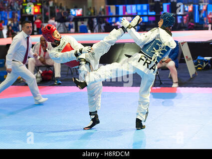 Burnaby, Canada. 16th Nov, 2016. WTF World Taekwondo Junior Championships, Zackarya Aziz (FRA) in blue and Cheng-Chun Chang (TPE) in red compete in 48kg class Credit: © Peter Llewellyn/Alamy Live News  Stock Photo