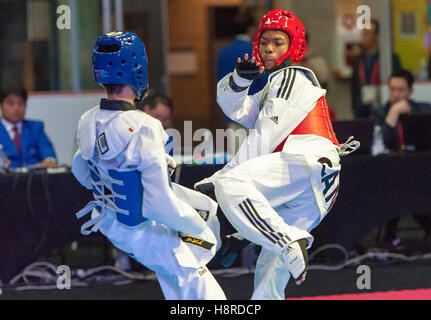 Burnaby, Canada. 16th Nov, 2016. WTF World Taekwondo Junior Championships, Georgios Ioannou (GRE) in blue and Darius Brown (CAN) in red compete in 48kg class. Credit:  Peter Llewellyn/Alamy Live News Stock Photo
