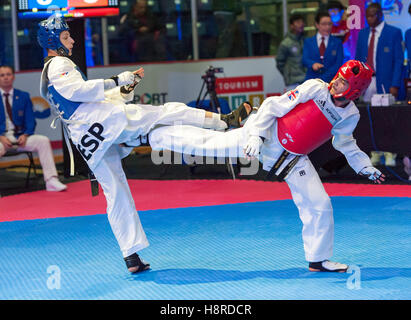 Burnaby, Canada. 16th Nov, 2016. WTF World Taekwondo Junior Championships, Alan Arcal Alcazar (ESP) in blue and Ilyas Hussain (GBR) in red compete in 48kg class. Credit:  Peter Llewellyn/Alamy Live News Stock Photo