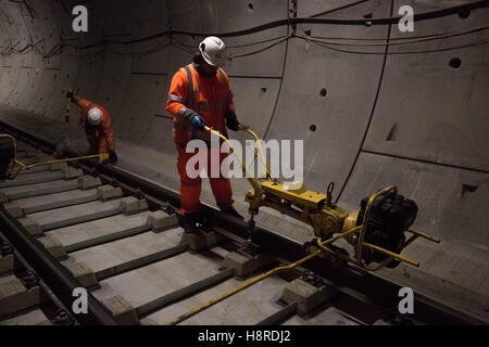 London, UK. 16th November, 2016. Crossrail Stepney Green station in East London. Westbound station. Workers grind and smooth the surface of the recently laid train tracks. Credit:  Guy Corbishley/17�Թ����� Live News Stock Photo
