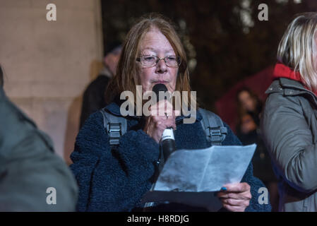 London, UK. 16th November 2016. Disabled People Against Cuts and Black Triangle protest against the grave and systematic violations of disabled people's rights by the UK government through welfare reforms, highlighted in the United Nations enquiry findings published recently, as Parliament debate the cut to Employment and Support Allowance. The event was also a vigil in remembrance of DPAC co-founder Debbie Jolly who died last week and LInda Burnip speaks about her work. Credit:  Peter Marshall/Alamy Live News Stock Photo