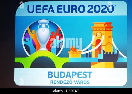 Budapest, Hungary. 16th Nov, 2016. The logo of the host city Budapest for the UEFA EURO 2020 is displayed on a screen during an event to unveil the Budapest's logo in Budapest, Hungary, on Nov. 16, 2016. Budapest's logo incorporates the Chain Bridge, one of Budapest's most famous landmarks. UEFA EURO 2020 will be held across 13 different European cities. © Attila Volgyi/Xinhua/Alamy Live News Stock Photo