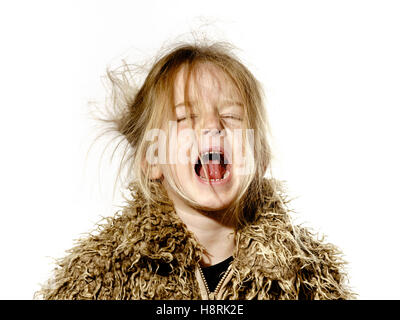 Disheveled preschooler girl with long hair crying, isolated on white background Stock Photo