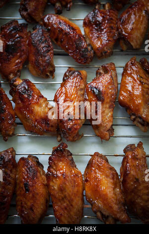 Hot bbq chicken wings on oven tray Stock Photo