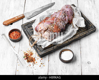 Beef rolled into knuckle in seasoning and spices Stock Photo