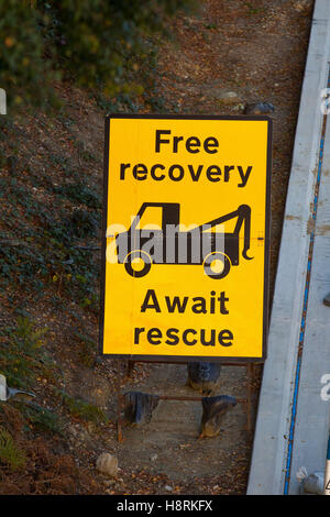 Free recovery await rescue roadworks sign on the M3 in Surrey, England, Britain. Stock Photo