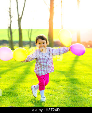 happy girl with colorful balloons Stock Photo