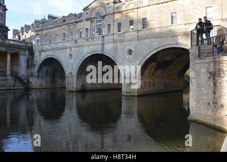 Two men admiring view from Riverside Walk near Pulteney Bridge, Bath, Somerset, England Stock Photo