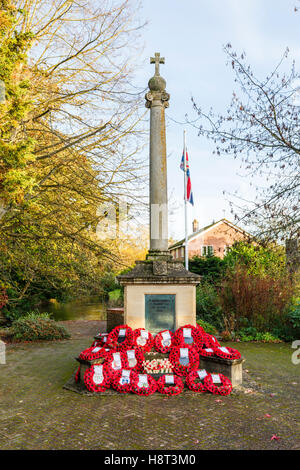 Typical First World War (Great War 1914-1918) war memorial with many poppy wreaths laid on Remembrance Sunday, Hungerford, Berkshire, southern England Stock Photo