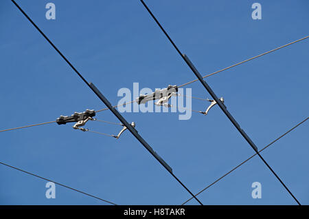 tram wires with blue sky background Stock Photo