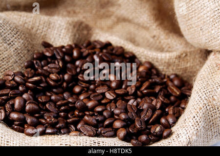 Roasted coffee beans on sacking Stock Photo