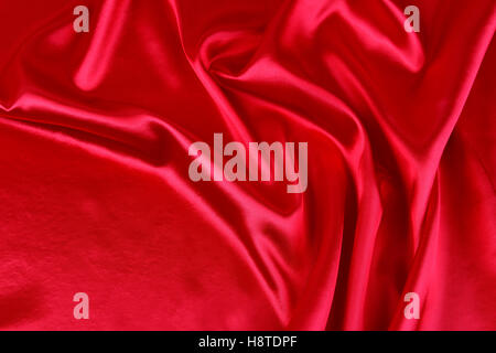 Closeup of ripples in red silk fabric Stock Photo
