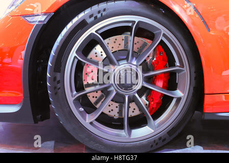 Large diameter disc on a brake system is a compulsory feature in many sports car to compensate its high maximum speed. Stock Photo