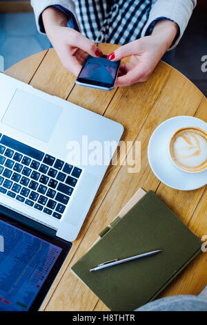 Unrecognizable Woman Using Phone and Having Coffee Stock Photo