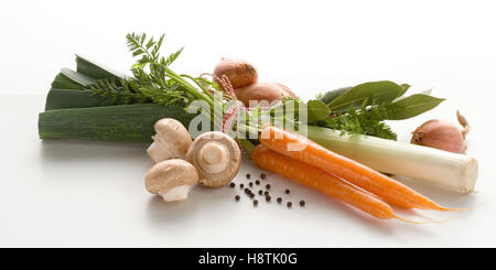 group of vegetables. Carrots, mushrooms and unions in front of white background Stock Photo