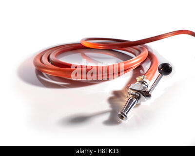 Red fire fighting hose with coupler and nozzle, Isolated on white background. Stock Photo