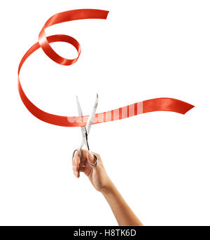 Scissors cutting through red ribbon or tape, isolated on white. Stock Photo