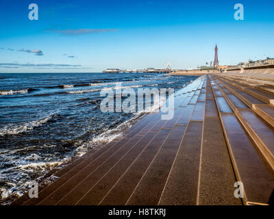 Blackpool Tower, Central Pier and stone steps forming part of sea defences, Blackpool, Lancashire, UK. Stock Photo