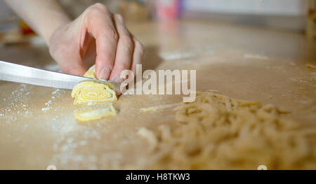 Woman's hands knead dough pasta Stock Photo