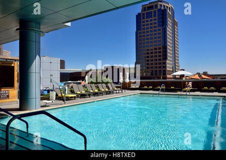 Rooftop swimming pool of Kimpton Palomar Phoenix hotel looking across to FedEx Office building downtown Phoenix, Arizona Stock Photo