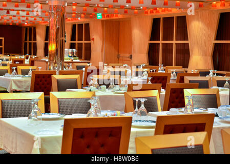 Tables and chairs in a restaurant in natural light Stock Photo