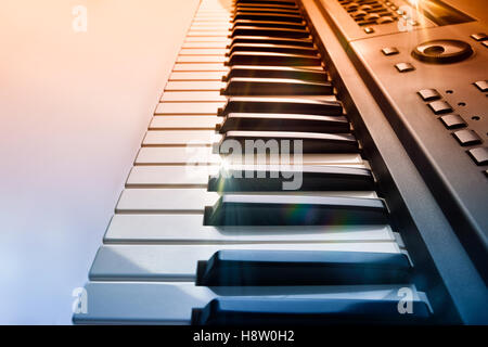 Synthesizer keyboard with shine and blue red gradient. Horizontal Composition.Elevated side view Stock Photo