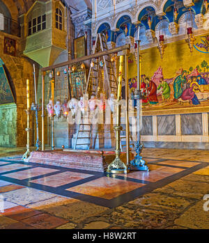 The Stone of Anointing  located next to the entrance to the Church of the Holy Sepulchre Stock Photo