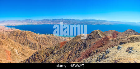 The scenic colorful landscape of Eilat mountains with Aqaba Gulf in the distance, Israel. Stock Photo