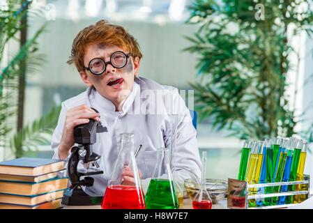 Young crazy chemist working in the lab Stock Photo