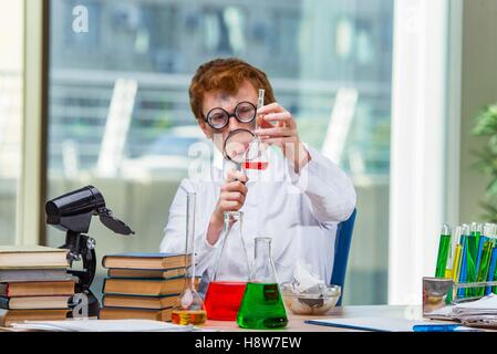 Young crazy chemist working in the lab Stock Photo