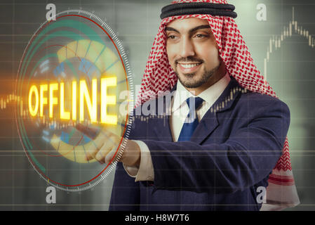 Arab man pressing offline button Stock Photo